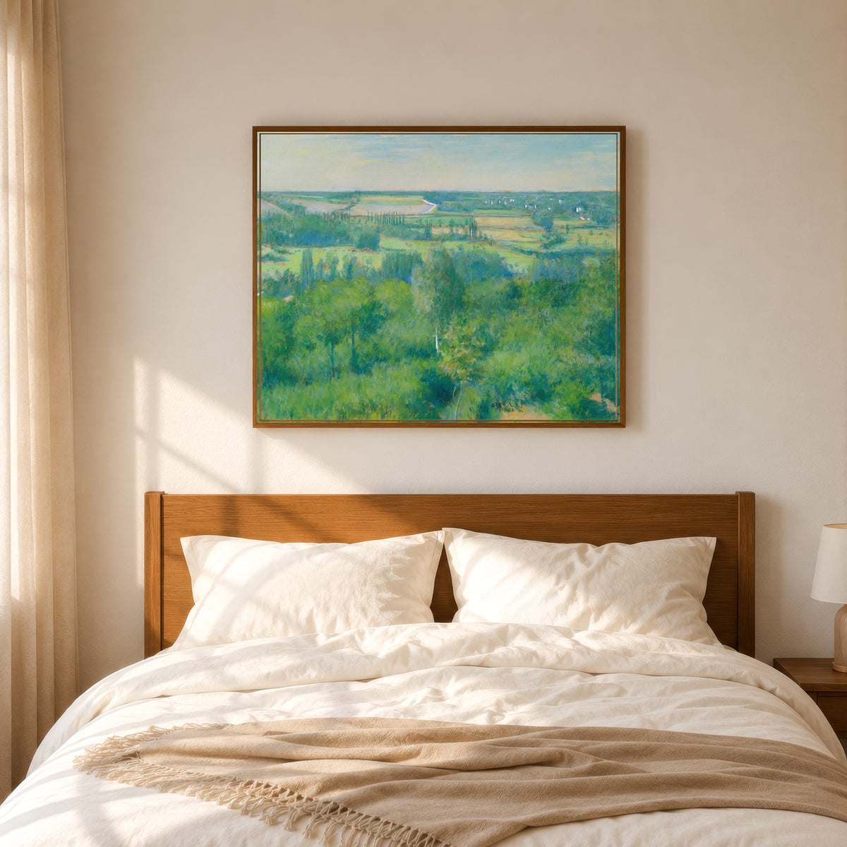 Framed art print of La Vallée de l'Yerres by Gustave Caillebotte, in a slim wood frame above a bed in a sunlit bedroom
