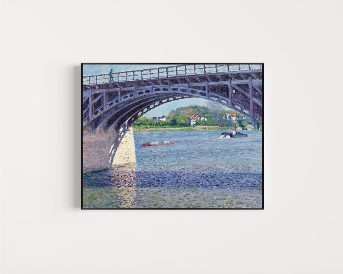 Framed art print of The Argenteuil Bridge and the Seine by Gustave Caillebotte, in a slim black frame on a plain white wall