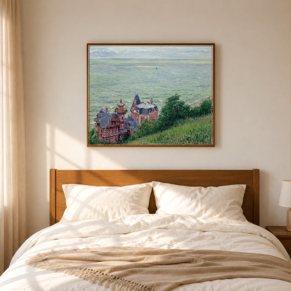 Framed art print of Villas at Trouville by Gustave Caillebotte, in a slim wood frame above a bed in a sunlit bedroom