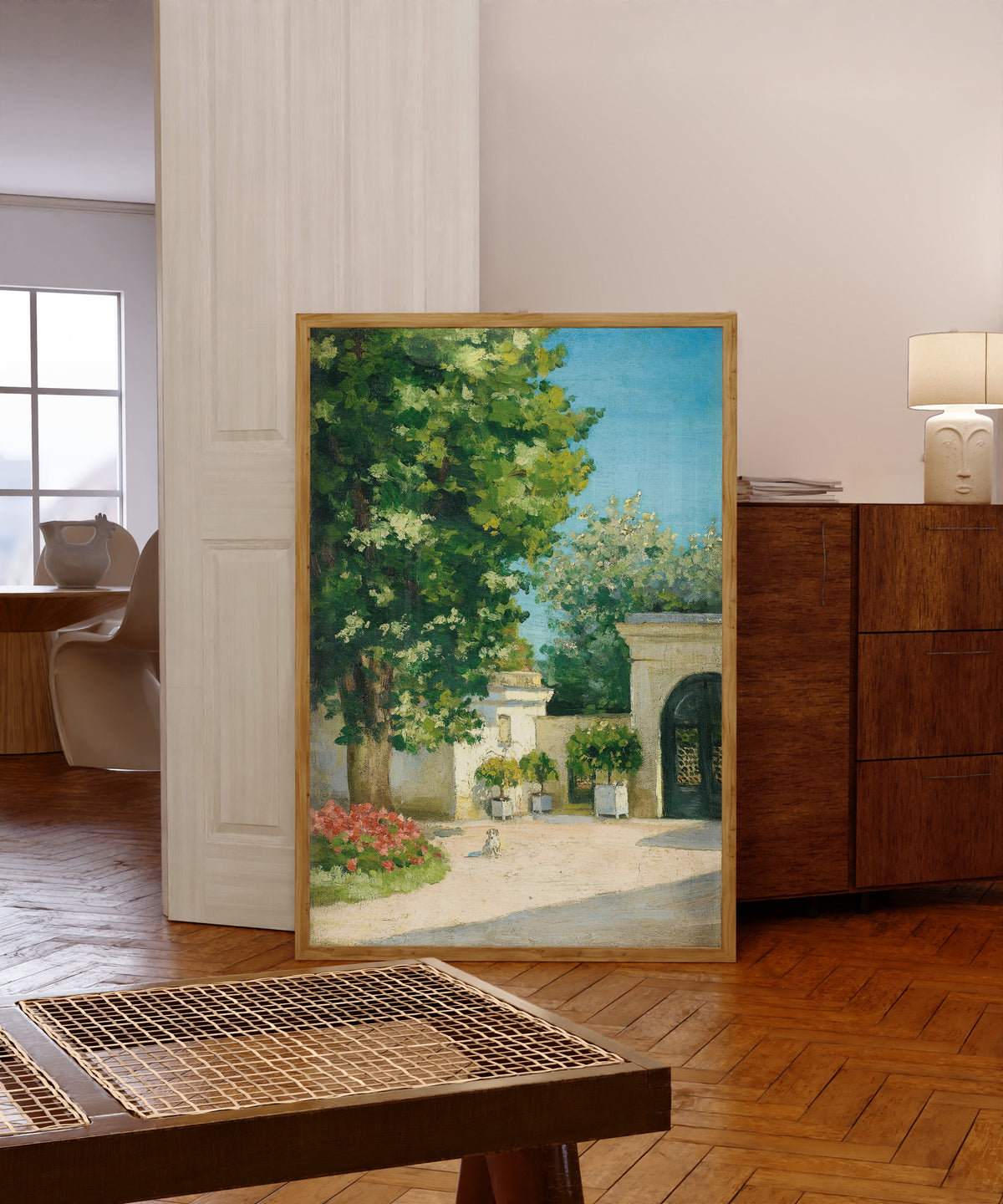 Framed art print of Yerres. De l'exèdre, le porche de la demeure… by Gustave Caillebotte, in a light wood frame leaning in a warm room with a parquet floor