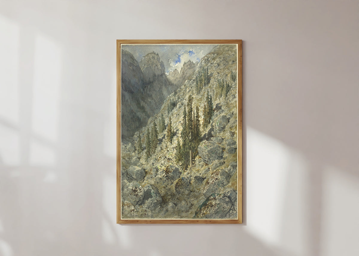 Framed art print of An Alpine Valley with Trees and Boulders by Gustave Doré, in a light wood frame on a sunlit white wall