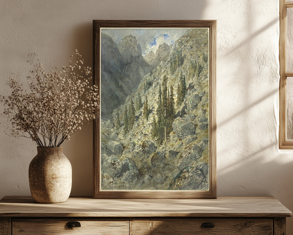 Framed art print of An Alpine Valley with Trees and Boulders by Gustave Doré, in a dark wood frame leaning on a rustic console beside dried flowers