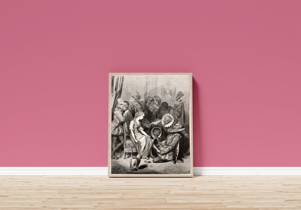 Framed art print of Cinderella: The Glass Slipper by Gustave Doré, in a light wood frame leaning on a pink wall above a wooden floor