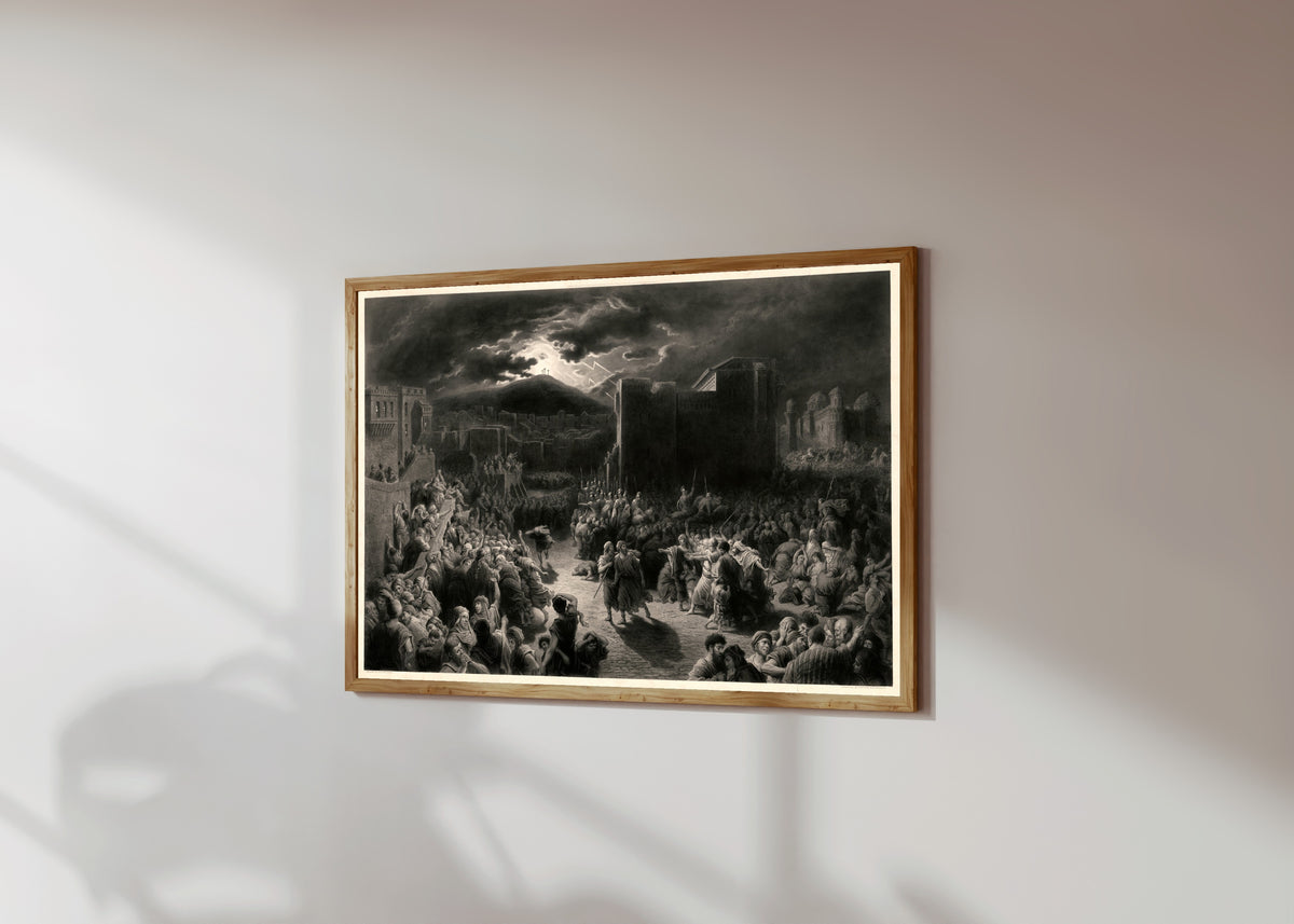 Framed art print of Crucifixion Scene in a Storm-lit Town by Gustave Doré, in a light wood frame on a sunlit white wall, seen at a slight angle