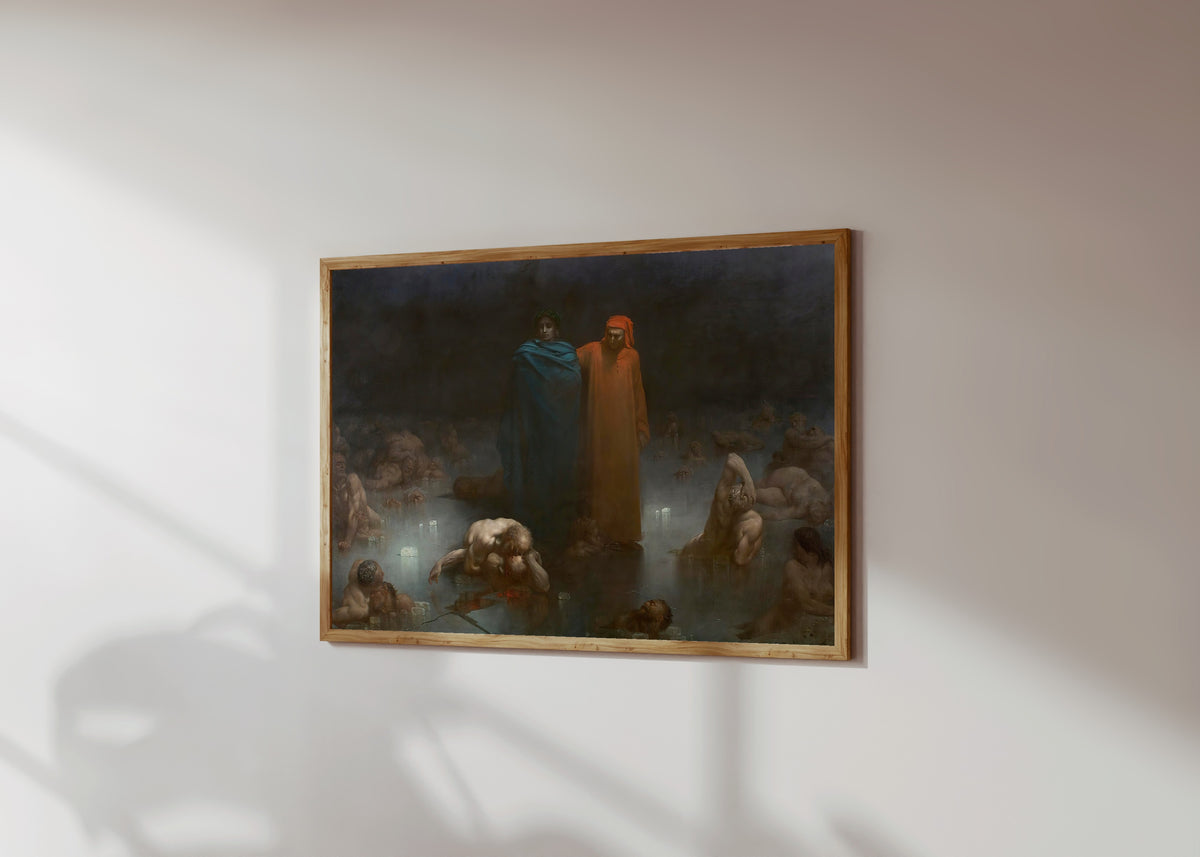 Framed art print of Dante and Virgil in the Ninth Circle of Hell by Gustave Doré, in a light wood frame on a sunlit white wall, seen at a slight angle