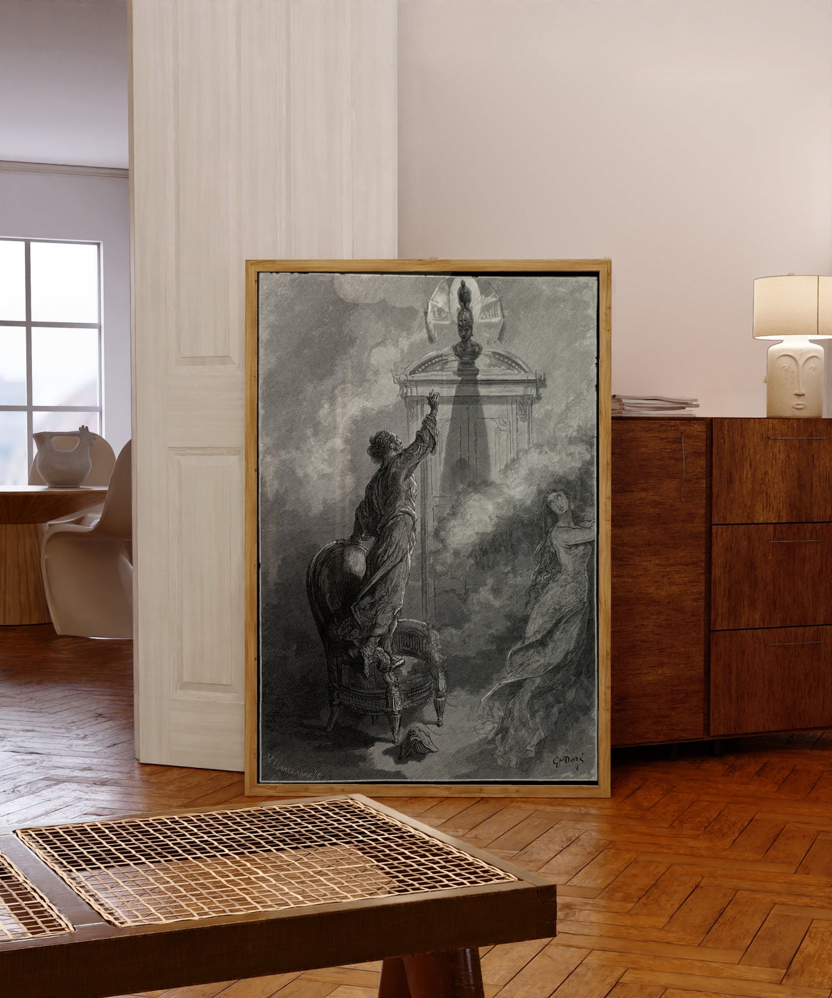 Framed art print of Is there balm in Gilead? by Gustave Doré, in a light wood frame leaning in a warm room with a parquet floor