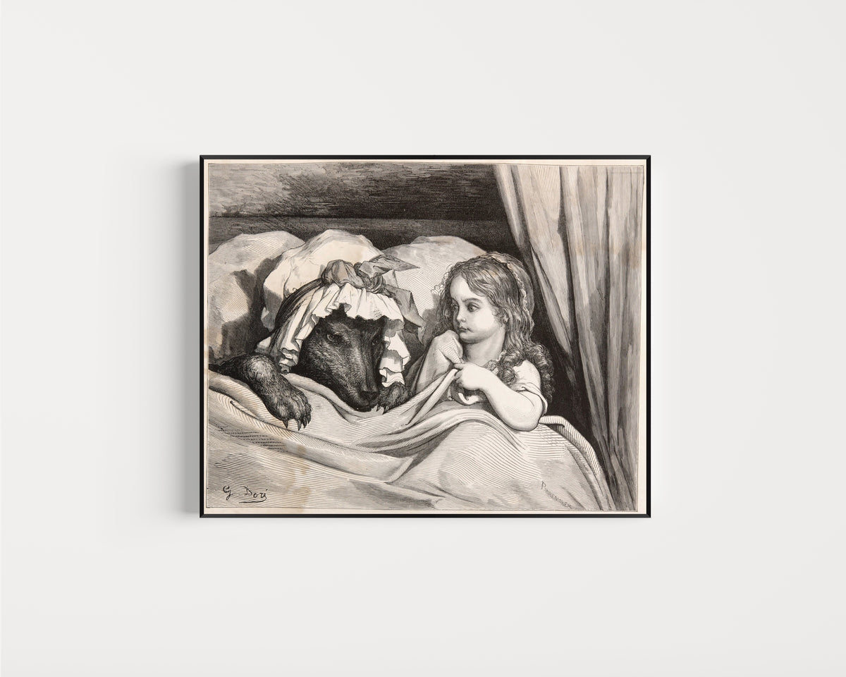 Framed art print of Little Red Riding Hood: In Bed with the Wolf by Gustave Doré, in a slim black frame on a plain white wall