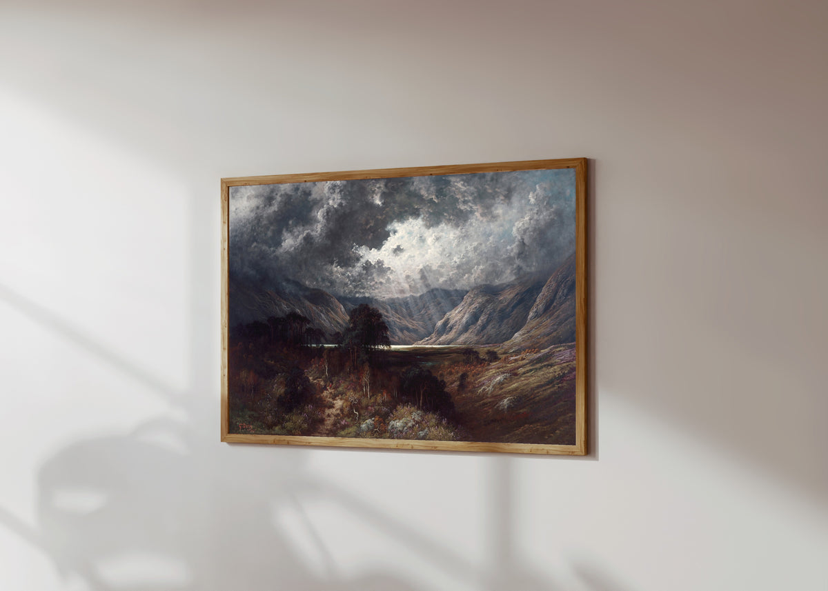 Framed art print of Loch Lomond by Gustave Doré, in a light wood frame on a sunlit white wall, seen at a slight angle