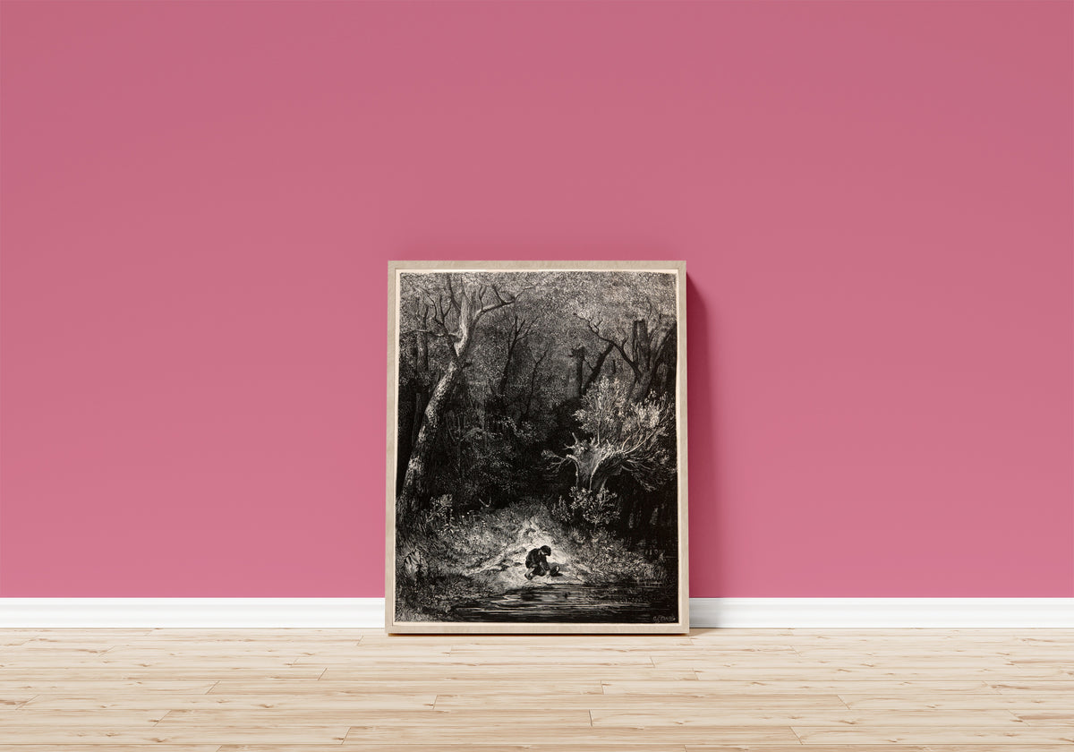 Framed art print of Tom Thumb: Gathering Pebbles by the Stream by Gustave Doré, in a light wood frame leaning on a pink wall above a wooden floor