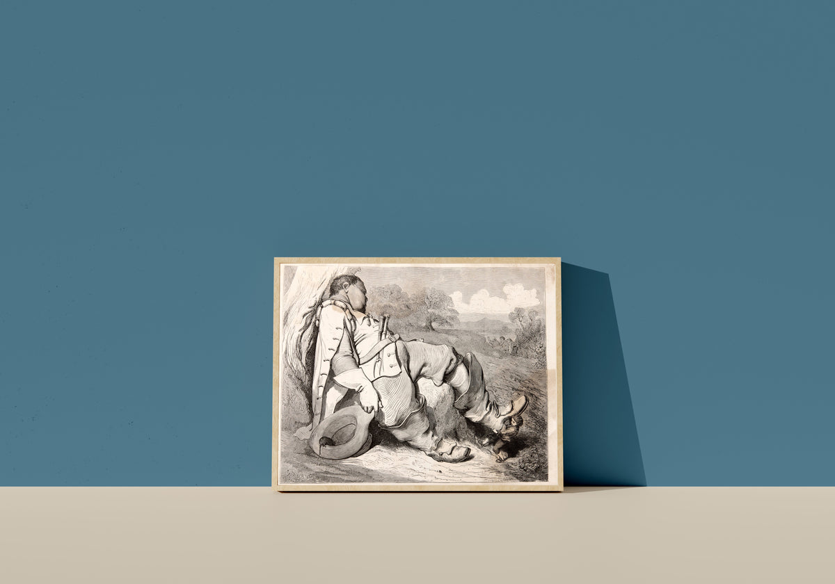 Framed art print of Tom Thumb: The Ogre Asleep by Gustave Doré, in a light wood frame leaning on a blue wall
