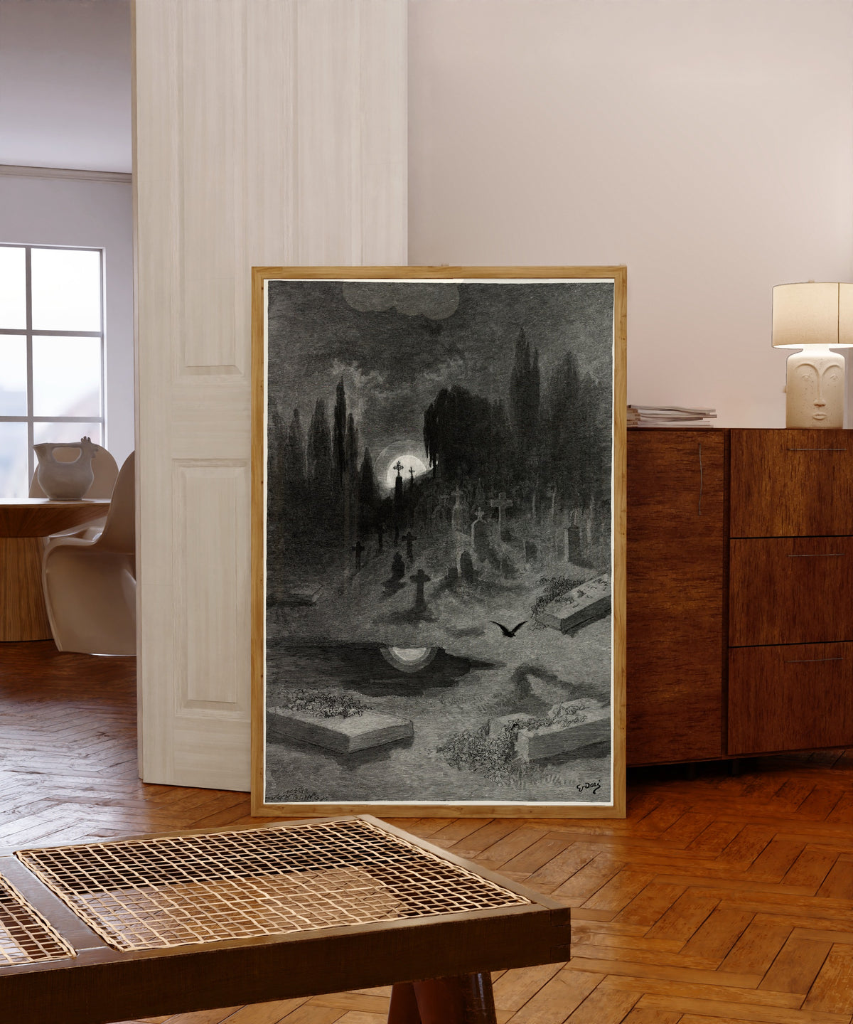 Framed art print of Wandering from the Nightly shore by Gustave Doré, in a light wood frame leaning in a warm room with a parquet floor
