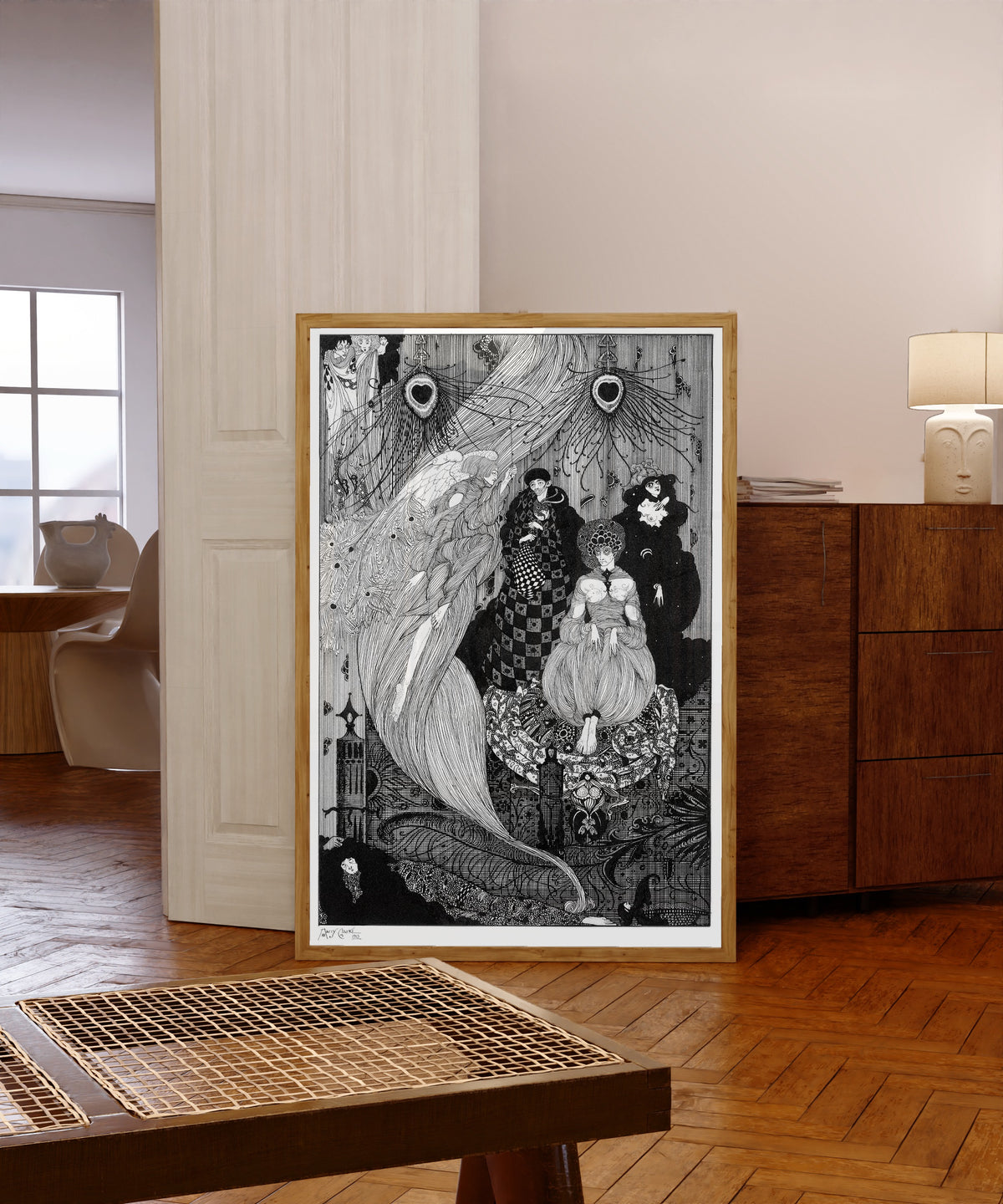Framed art print of Down to the Central Earth, His Proper Scene by Harry Clarke, in a light wood frame leaning in a warm room with a parquet floor