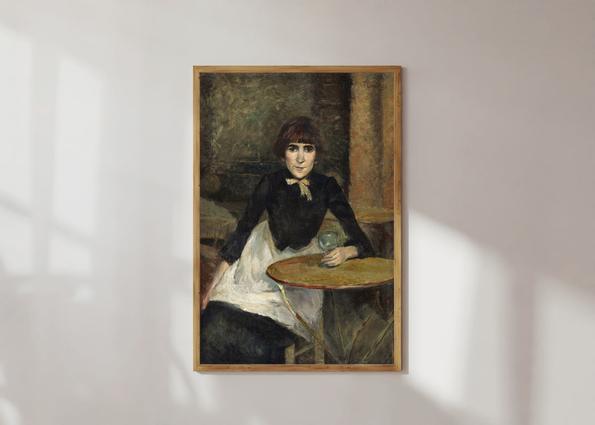 Framed art print of A la Bastille (Jeanne Wenz) by Henri de Toulouse-Lautrec, in a light wood frame on a sunlit white wall