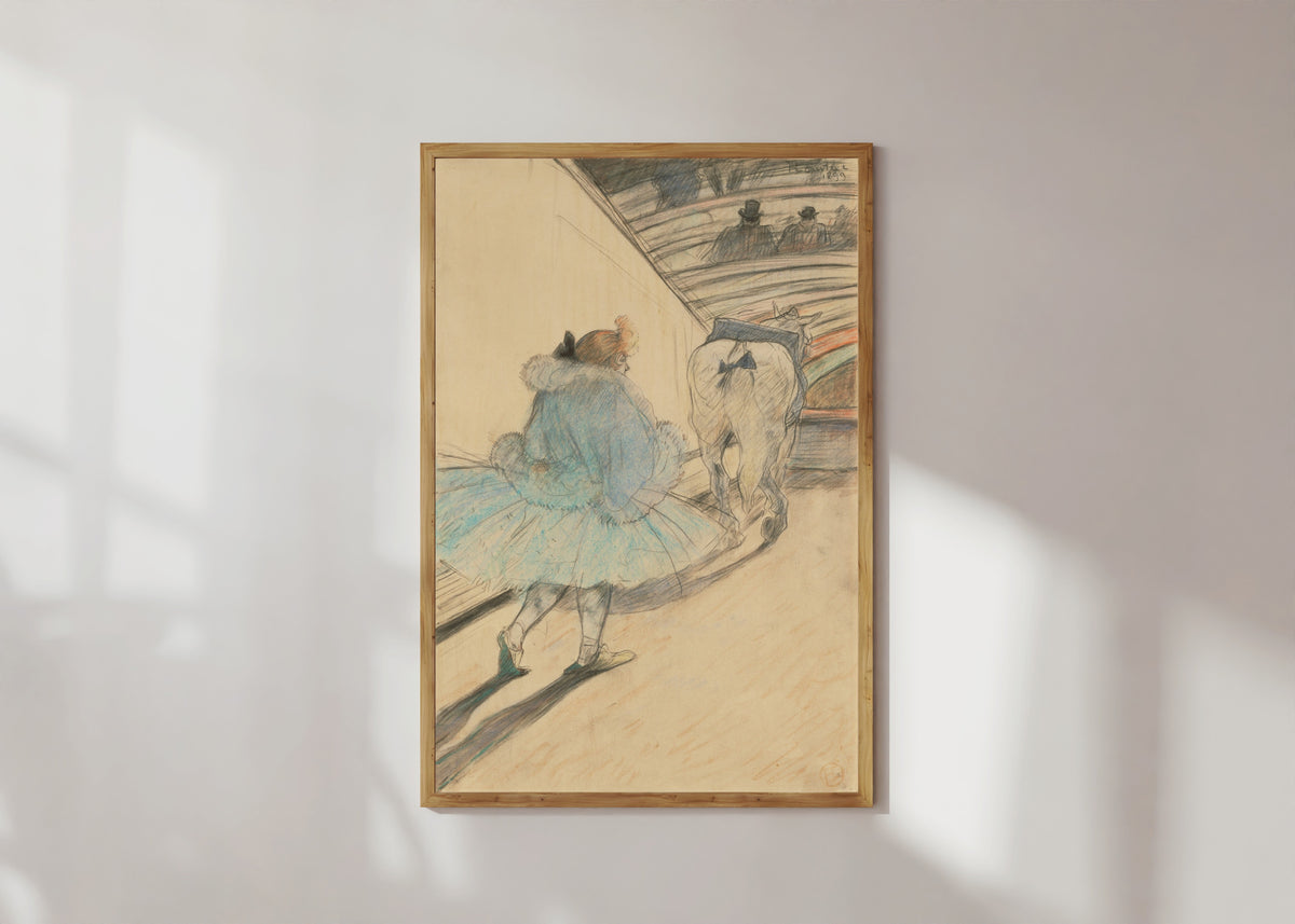 Framed art print of At the Circus: Entering the Ring by Henri de Toulouse-Lautrec, in a light wood frame on a sunlit white wall