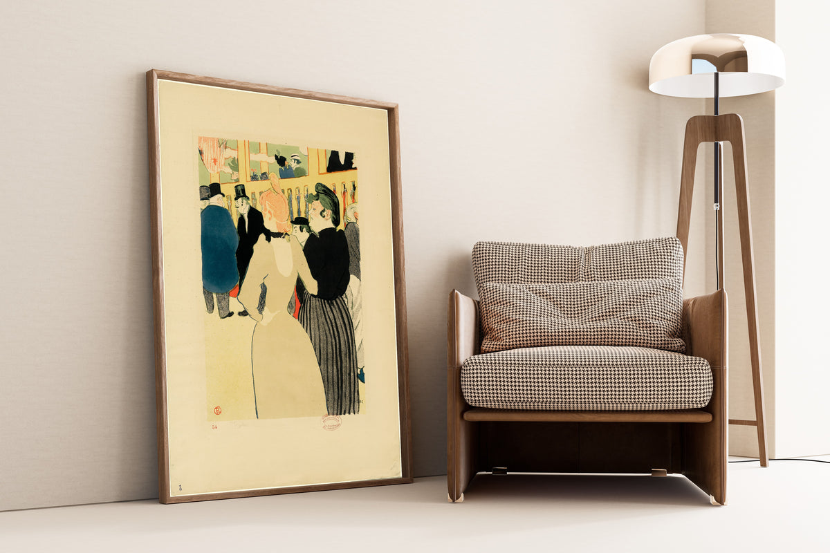 At the Moulin Rouge, La Goulue and Her Sister by Henri de Toulouse-Lautrec — framed and leaning against a wall beside an armchair and a floor lamp