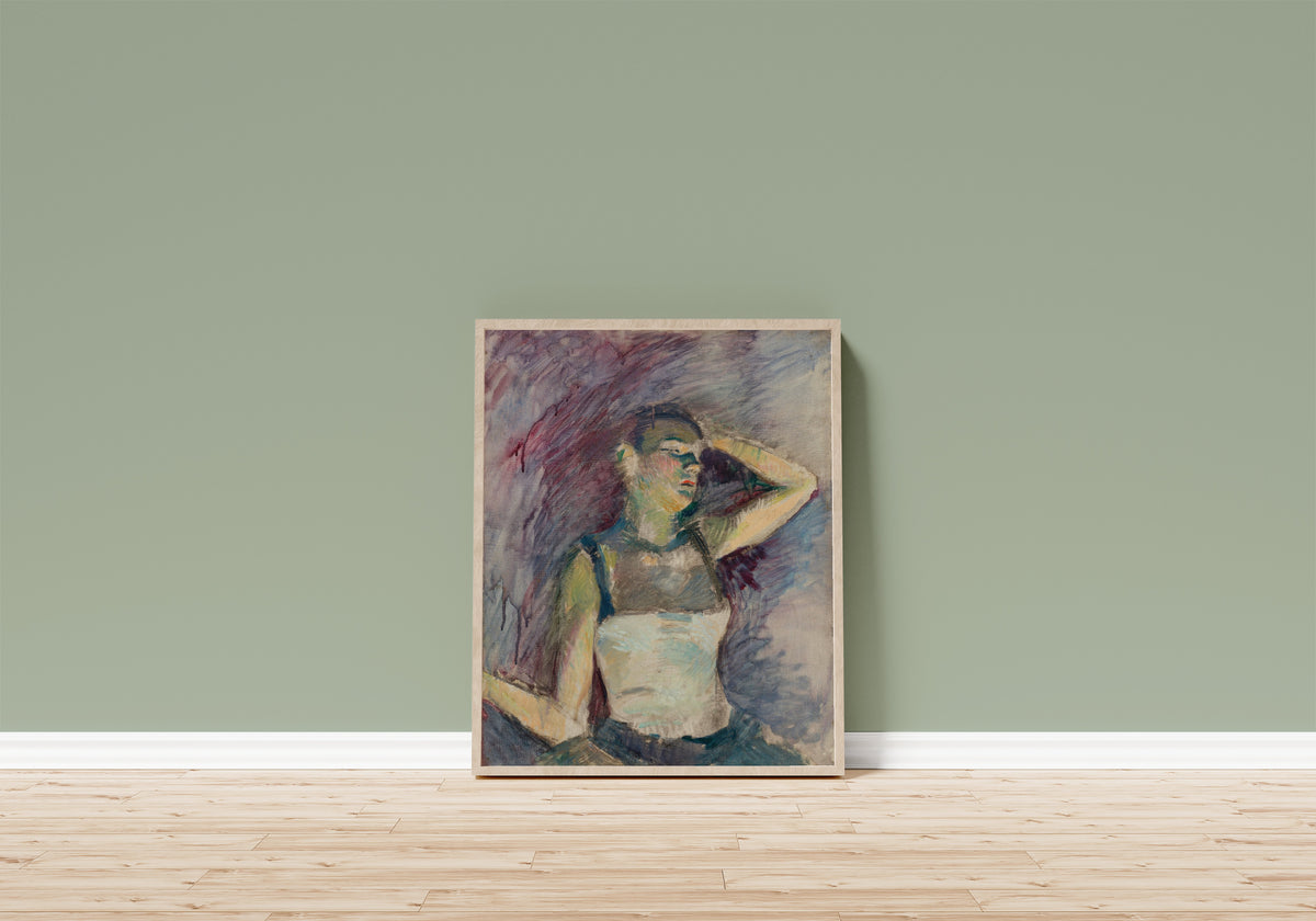 Framed art print of Étude de danseuse by Henri de Toulouse-Lautrec, in a light wood frame leaning on a sage green wall above a wooden floor