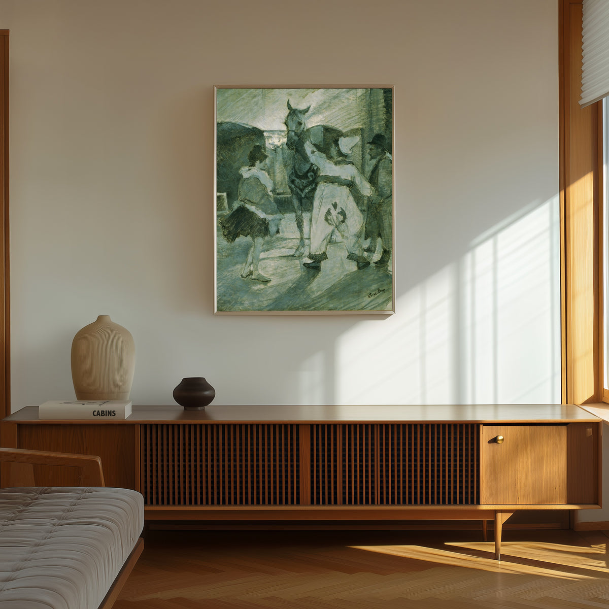 Framed art print of In the Wings at the Circus by Henri de Toulouse-Lautrec, in a thin light frame on a sunlit wall above a wooden sideboard