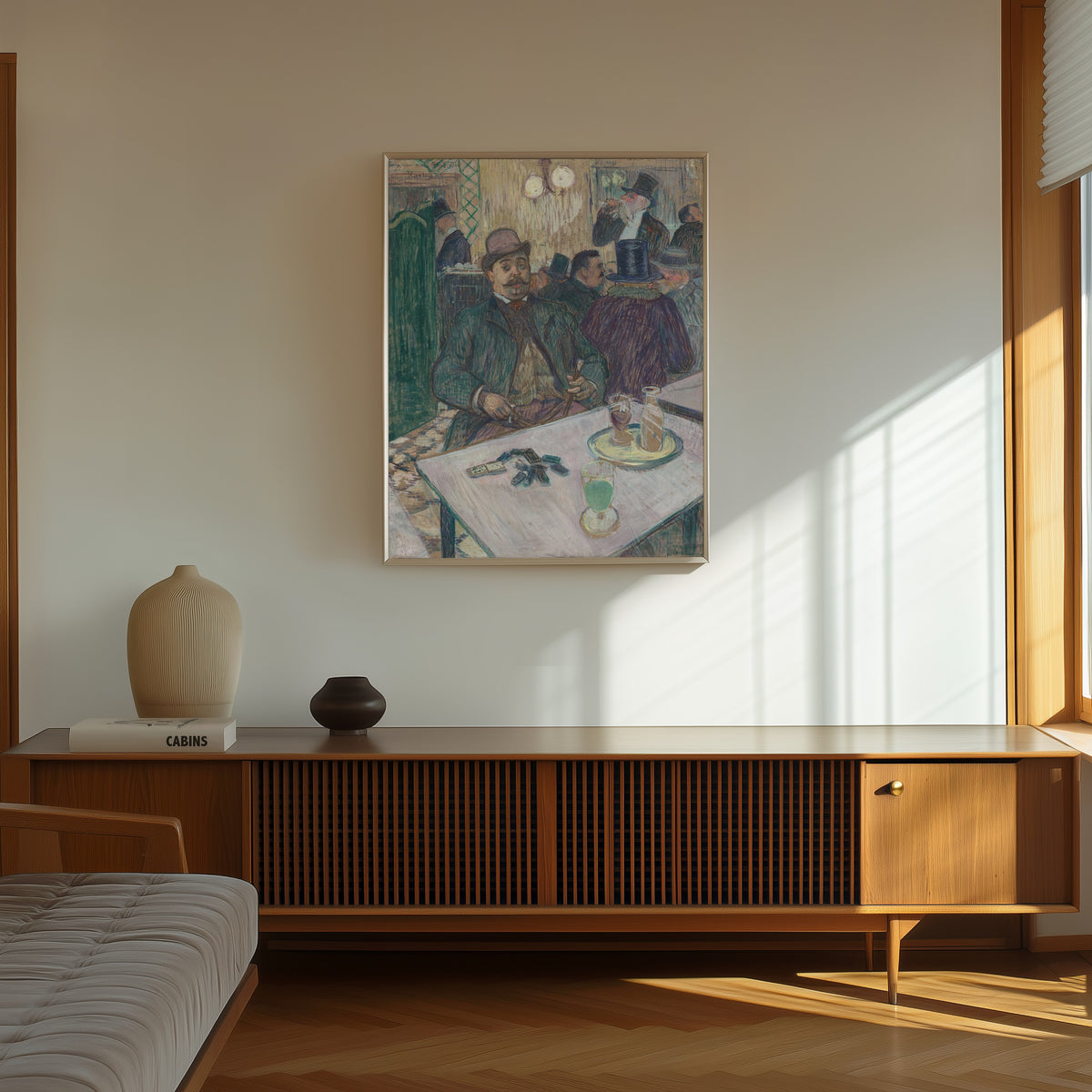Framed art print of Monsieur Boileau at the Café by Henri de Toulouse-Lautrec, in a thin light frame on a sunlit wall above a wooden sideboard
