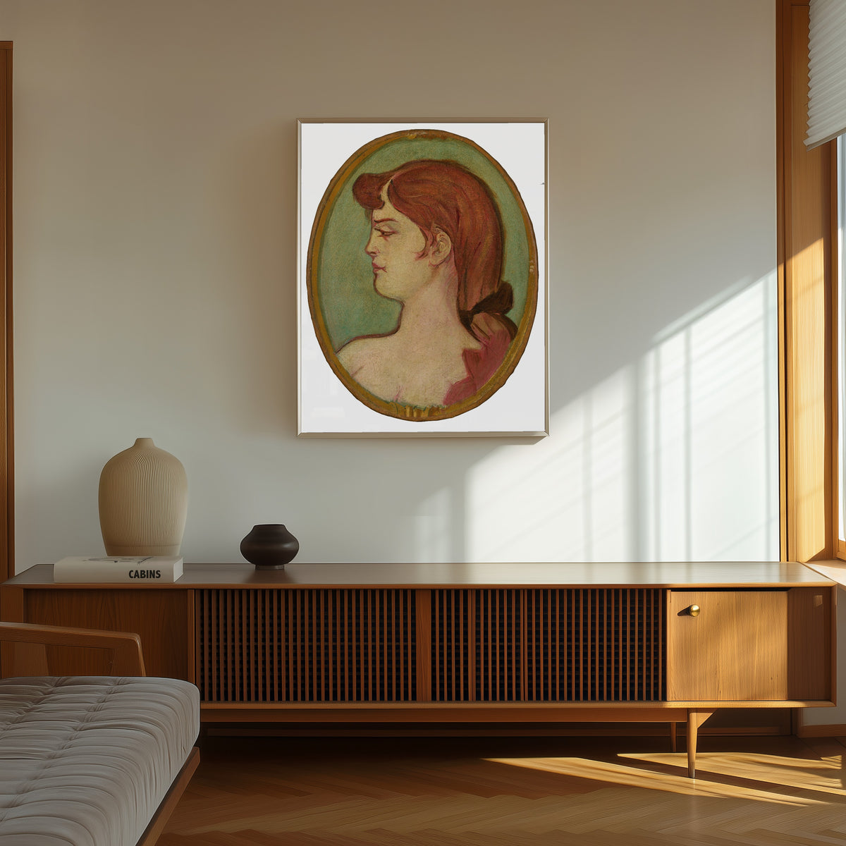 Framed art print of Portrait of a Woman of the House on the Rue… by Henri de Toulouse-Lautrec, in a thin light frame on a sunlit wall above a wooden sideboard