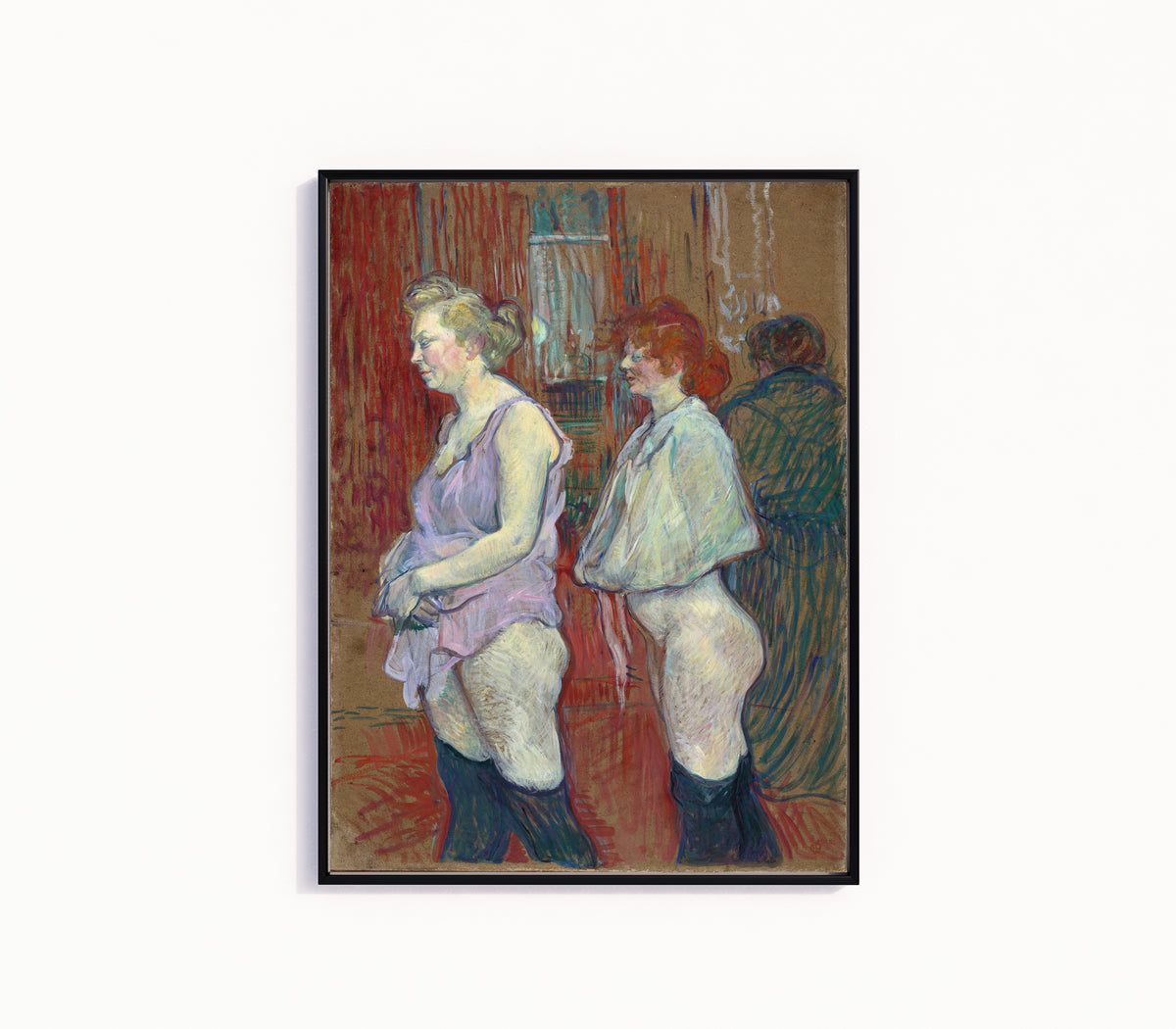 Framed art print of Rue des Moulins by Henri de Toulouse-Lautrec, in a slim black frame on a plain white wall