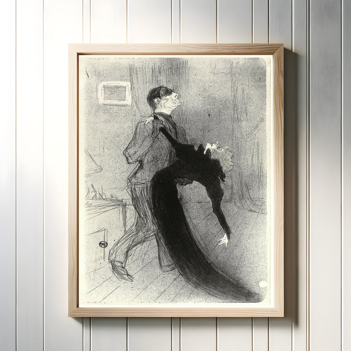 Framed art print of The Fainting Fit by Henri de Toulouse-Lautrec, in a light wood frame on a white panelled wall