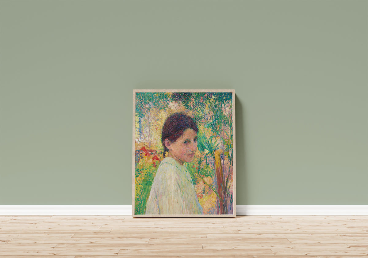 Framed art print of Buste de jeune fille de trois quart sur fond de… by Henri Martin, in a light wood frame leaning on a sage green wall above a wooden floor
