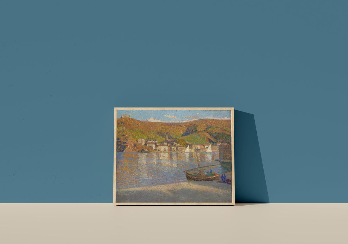 Framed art print of Cinq pêcheurs et leur barque échouée sur la grève à Collioure by Henri Martin, in a light wood frame leaning on a blue wall