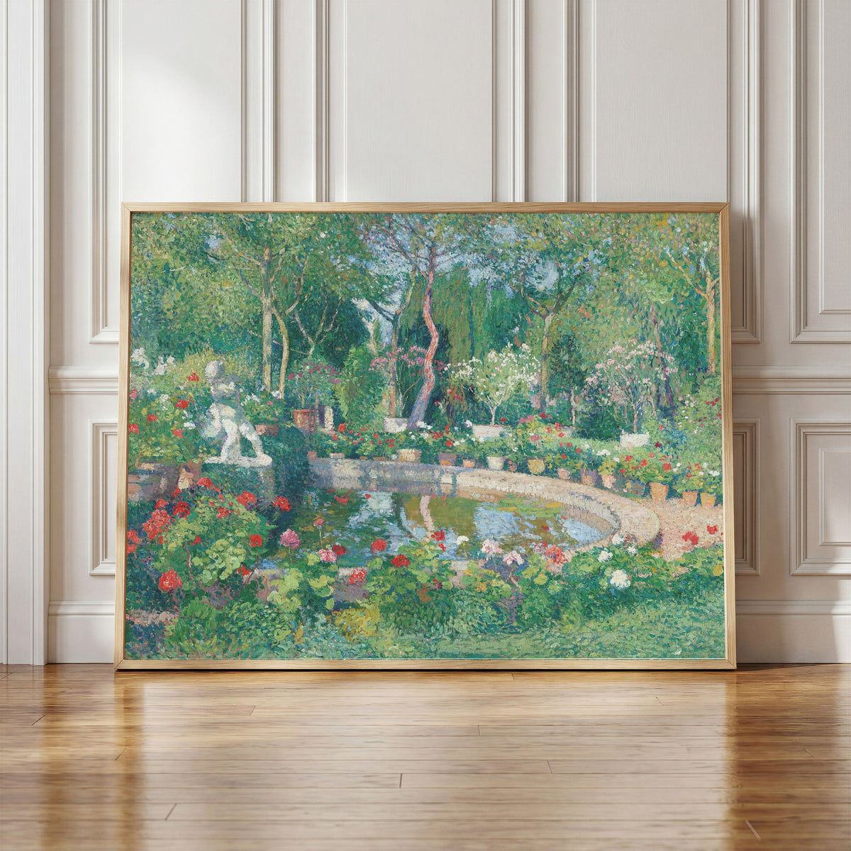 Framed art print of Grand bassin du parc de Marquayrol by Henri Martin, in a light wood frame leaning against a panelled white wall