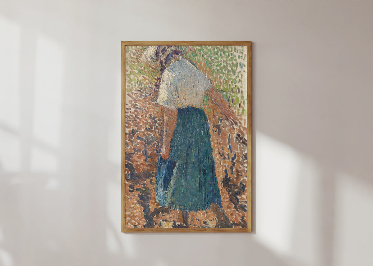 Framed art print of Jeune femme dans les vignes by Henri Martin, in a light wood frame on a sunlit white wall