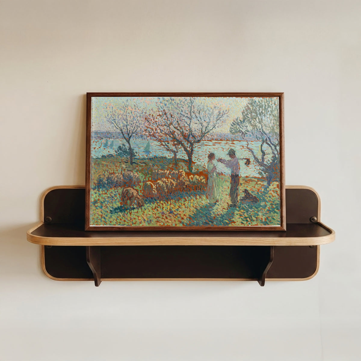 Framed art print of La Bergère et le paysan, rencontre vespérale by Henri Martin, in a dark wood frame resting on a wall shelf