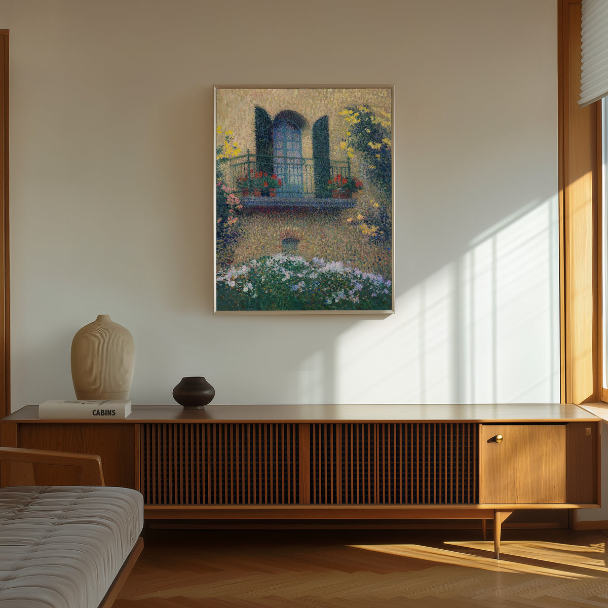 Framed art print of Le balcon de Jaurès by Henri Martin, in a thin light frame on a sunlit wall above a wooden sideboard