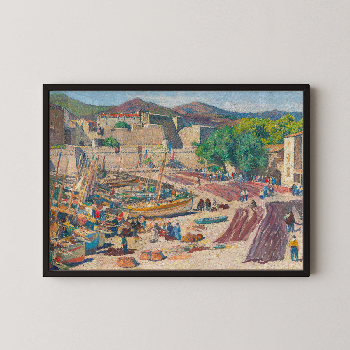 Framed art print of Port de Collioure le 14 juillet, séchage des filets sur la grève by Henri Martin, in a black frame on a pale wall