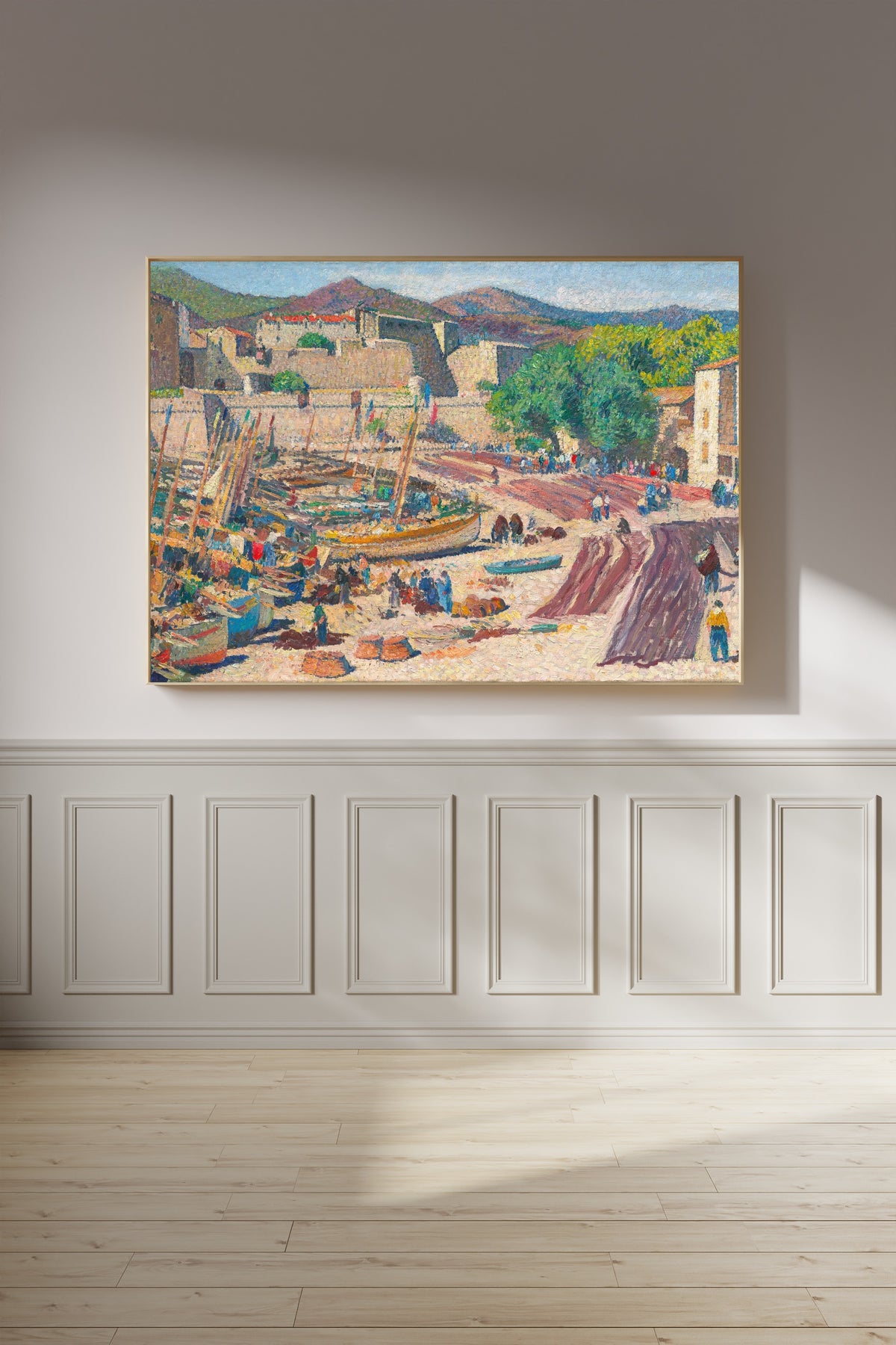 Framed art print of Port de Collioure le 14 juillet, séchage des filets sur la grève by Henri Martin, on a panelled wall in afternoon light