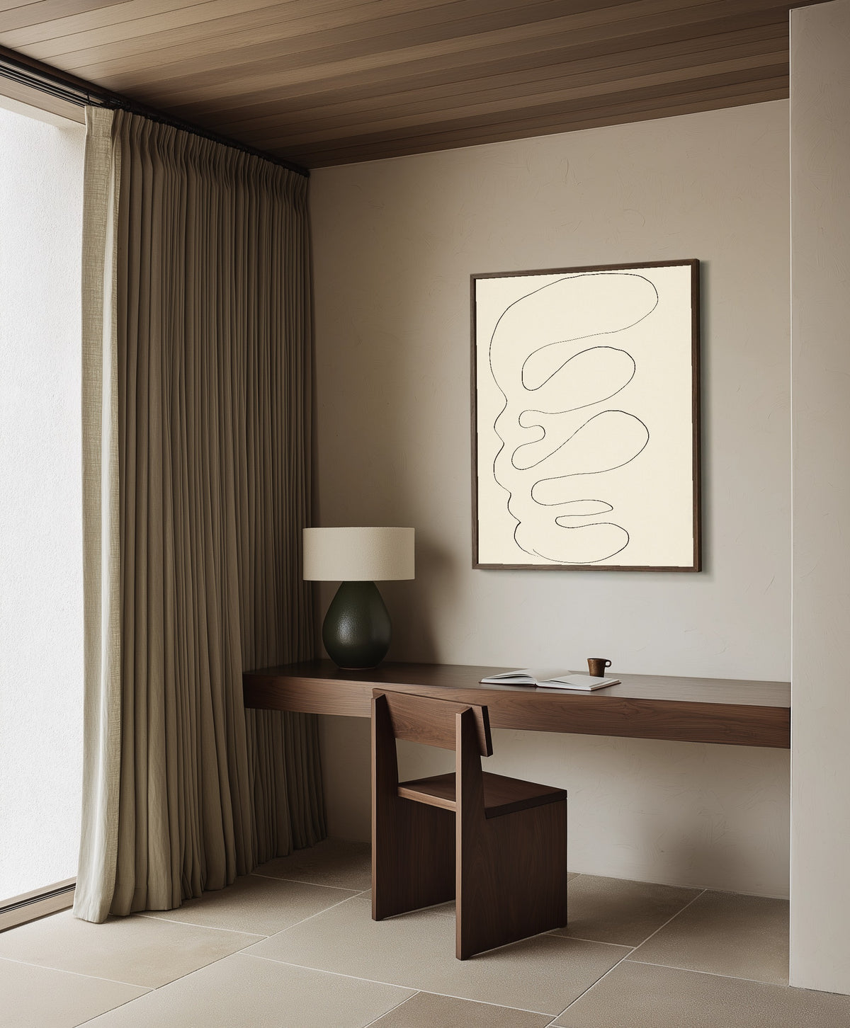 Framed art print of Arabesque by Henri Matisse, in a dark wood frame on a plaster wall above a walnut desk