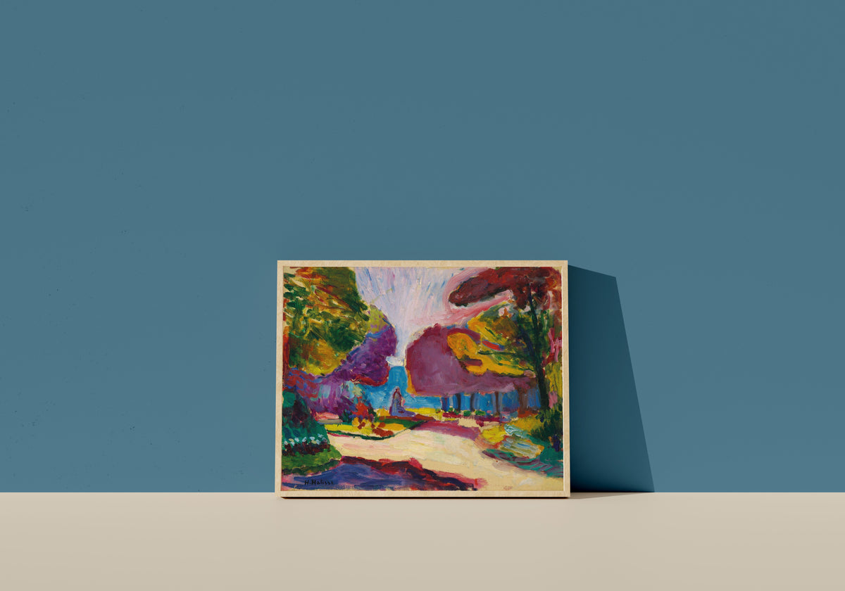 Framed art print of Jardin du Luxembourg, Paris by Henri Matisse, in a light wood frame leaning on a blue wall