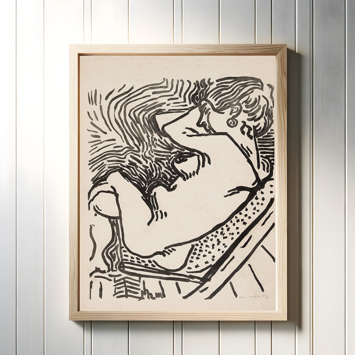 Framed art print of Le Grand Bois by Henri Matisse, in a light wood frame on a white panelled wall