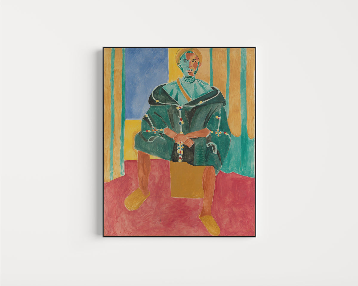 Framed art print of Seated Riffian by Henri Matisse, in a slim black frame on a plain white wall