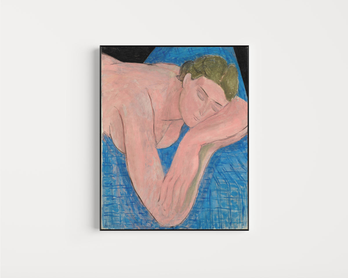 Framed art print of The Dream (Le Rêve) by Henri Matisse, in a slim black frame on a plain white wall