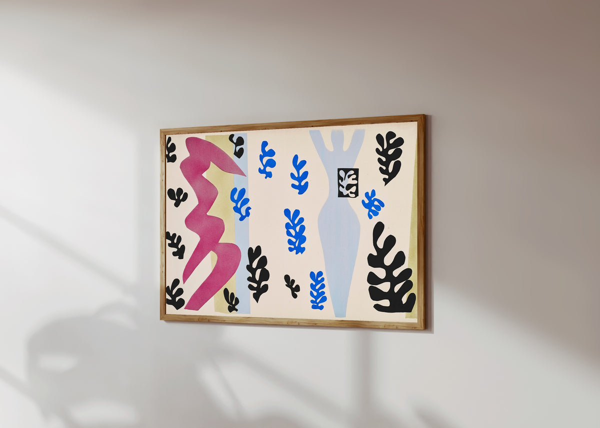 Framed art print of The Knife Thrower by Henri Matisse, in a light wood frame on a sunlit white wall, seen at a slight angle