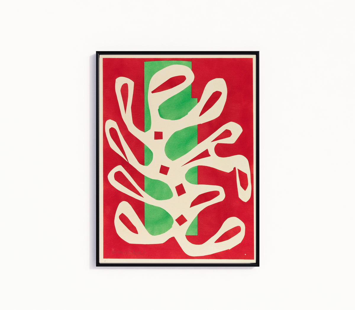 Framed art print of White Algae on Red and Green Ground by Henri Matisse, in a slim black frame on a plain white wall