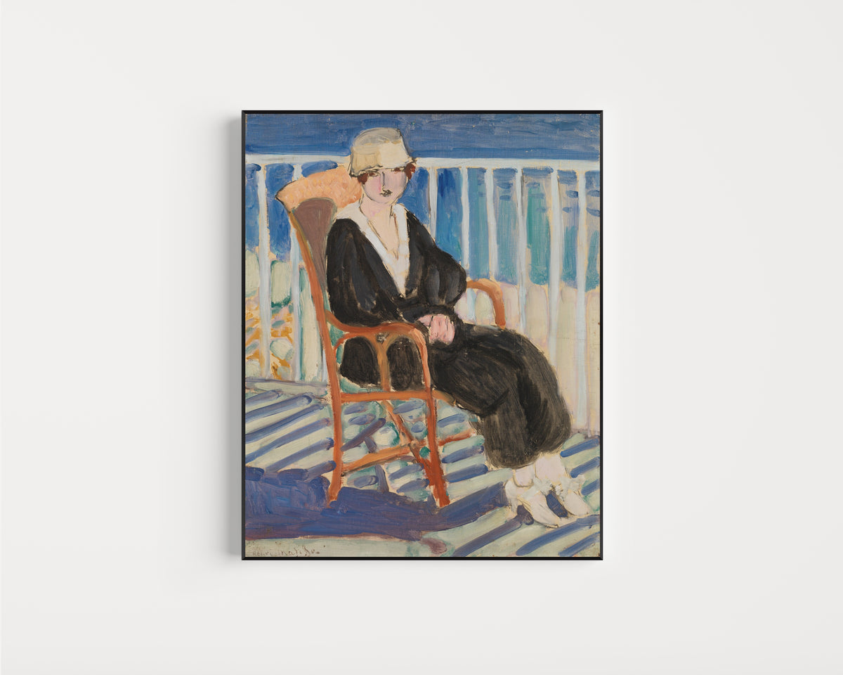 Framed art print of Young Girl on a Balcony over the Ocean by Henri Matisse, in a slim black frame on a plain white wall