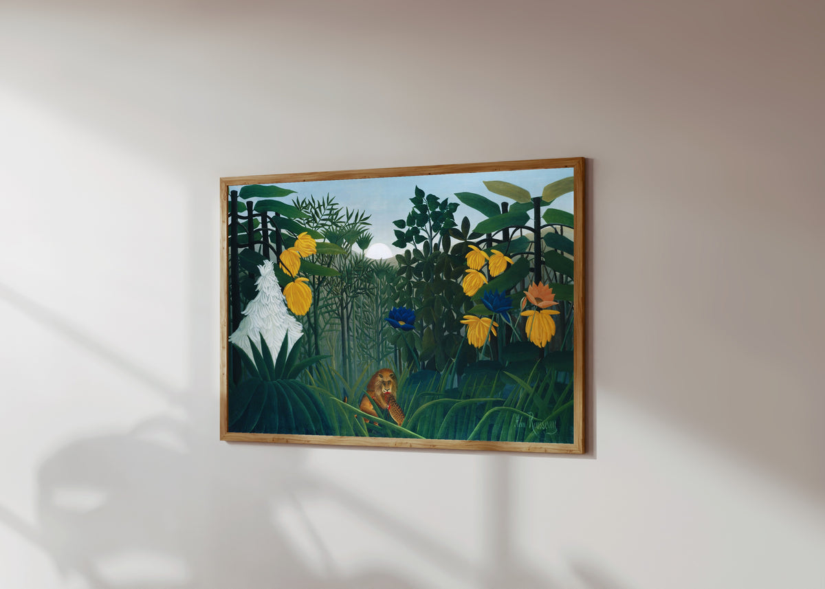 Framed art print of The Repast of the Lion by Henri Rousseau, in a light wood frame on a sunlit white wall, seen at a slight angle