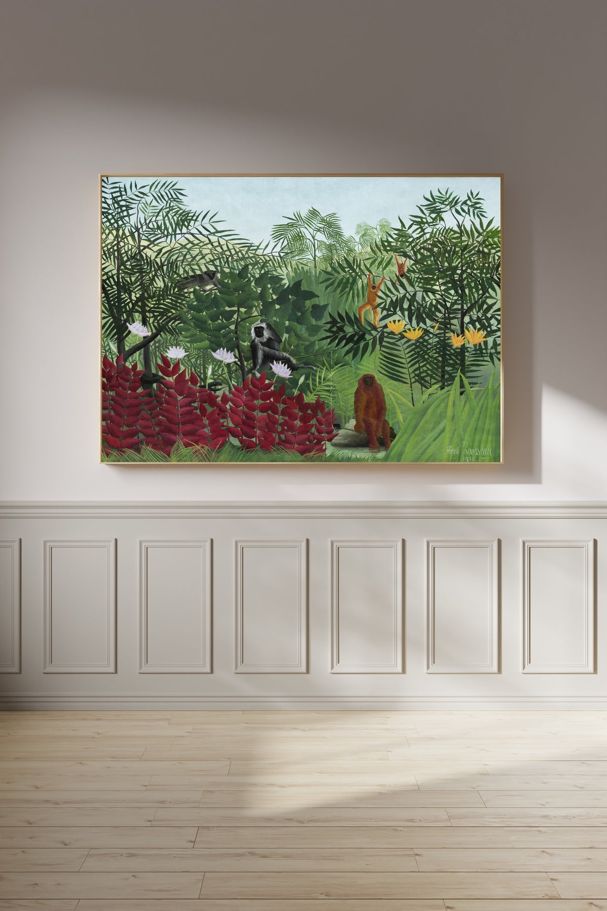Tropical Forest with Monkeys by Henri Rousseau — framed on a panelled wall in afternoon light