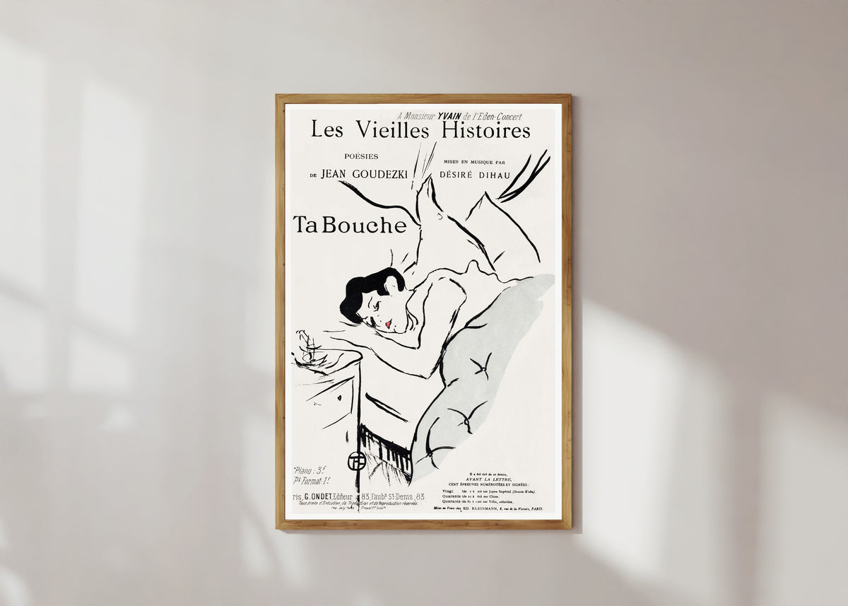 Framed art print of Ta Bouche by Henri de Toulouse-Lautrec, in a light wood frame on a sunlit white wall