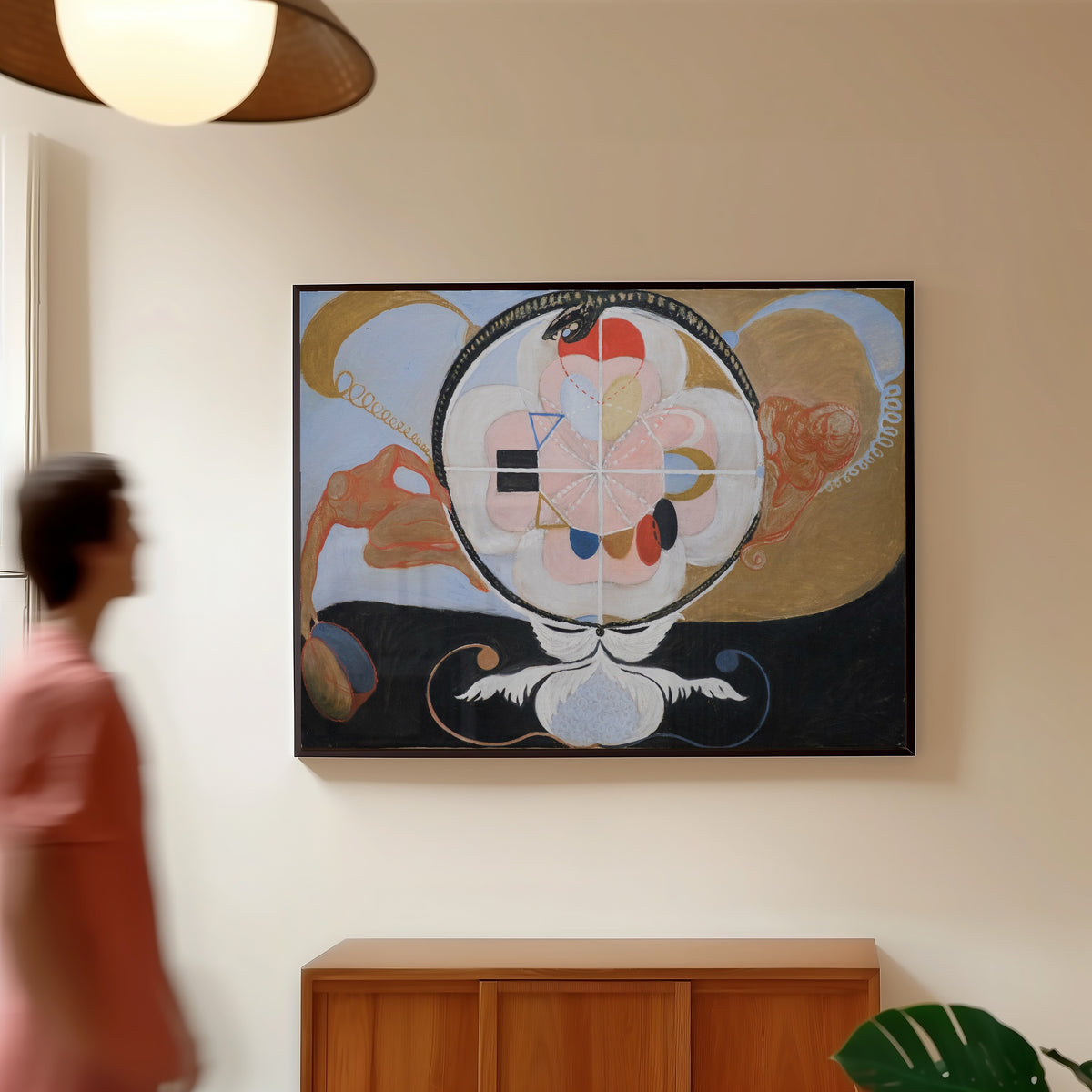 Framed art print of Evolution, No. 13, Group VI by Hilma af Klint, in a slim black frame on a warm wall in a sunlit room