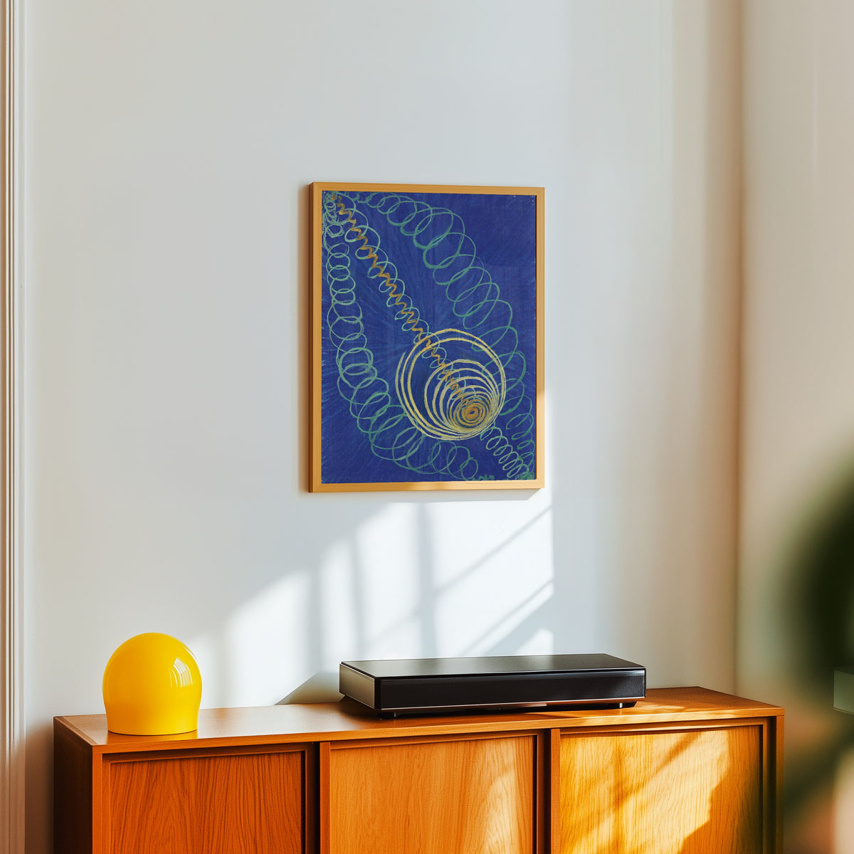 Framed art print of Primordial Chaos, No. 16, The WU-ROSEN Series, Group 1 by Hilma af Klint, in a light wood frame on a white wall above an orange sideboard