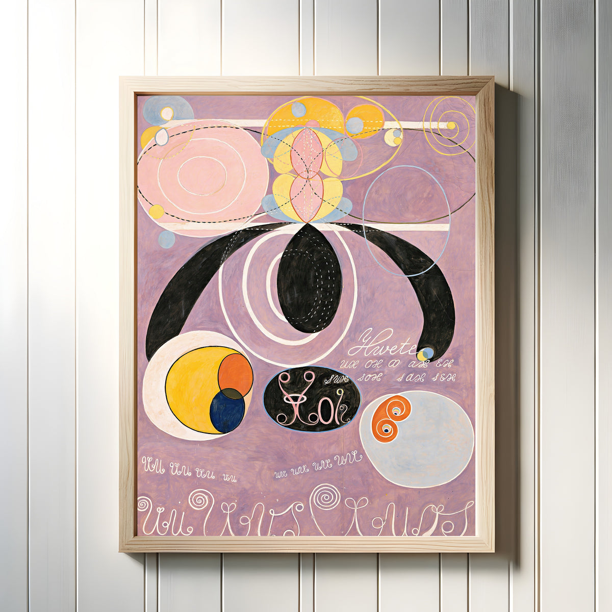 Framed art print of The Ten Largest, No. 6 by Hilma af Klint, in a light wood frame on a white panelled wall