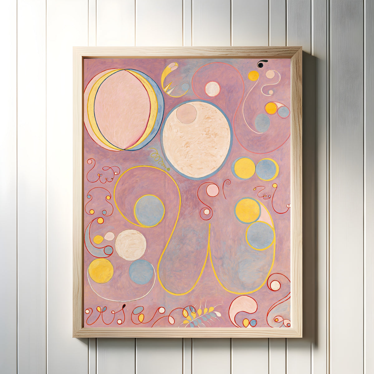 Framed art print of The Ten Largest, No. 8, Adulthood by Hilma af Klint, in a light wood frame on a white panelled wall