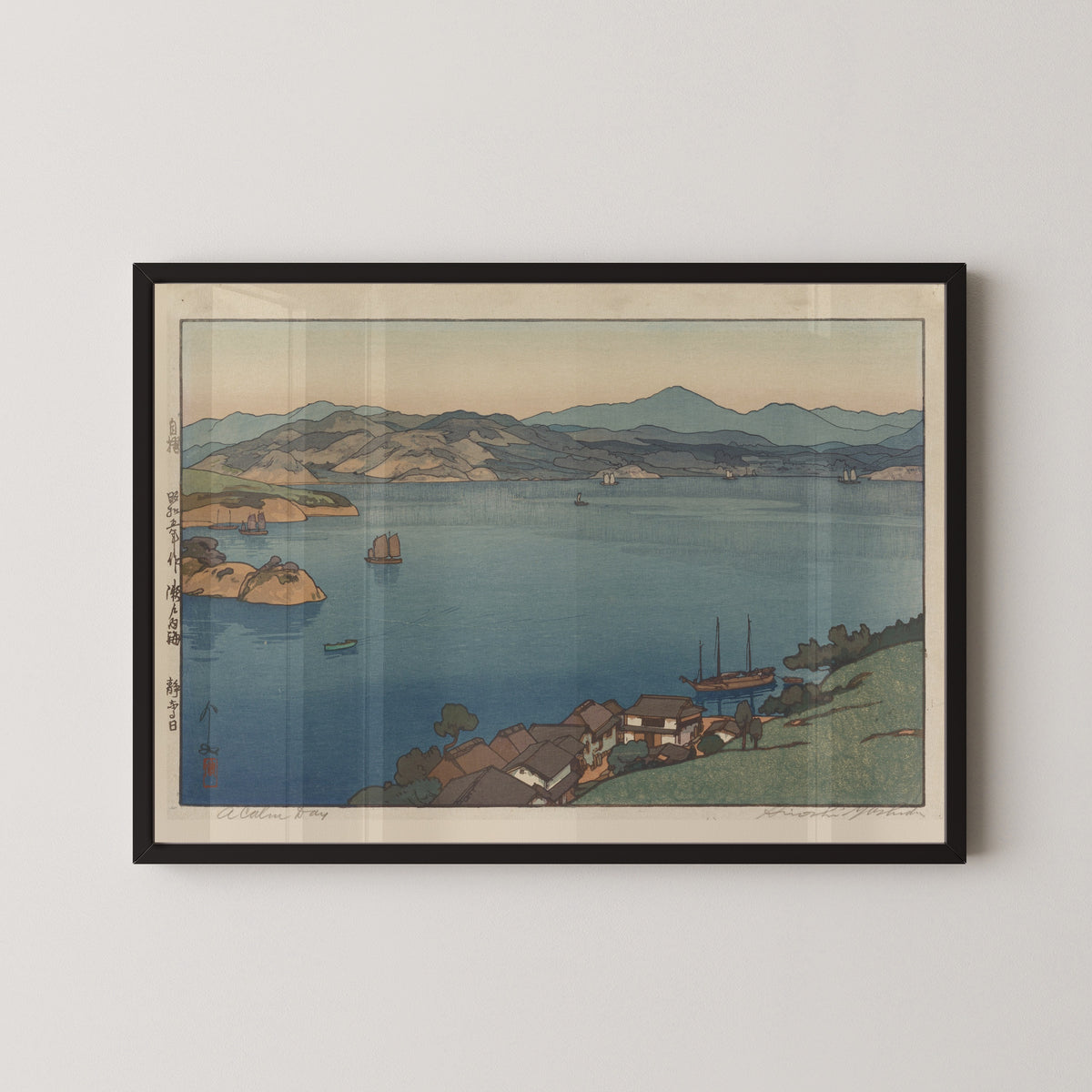 Framed art print of A Calm Day by Hiroshi Yoshida, in a black frame on a pale wall
