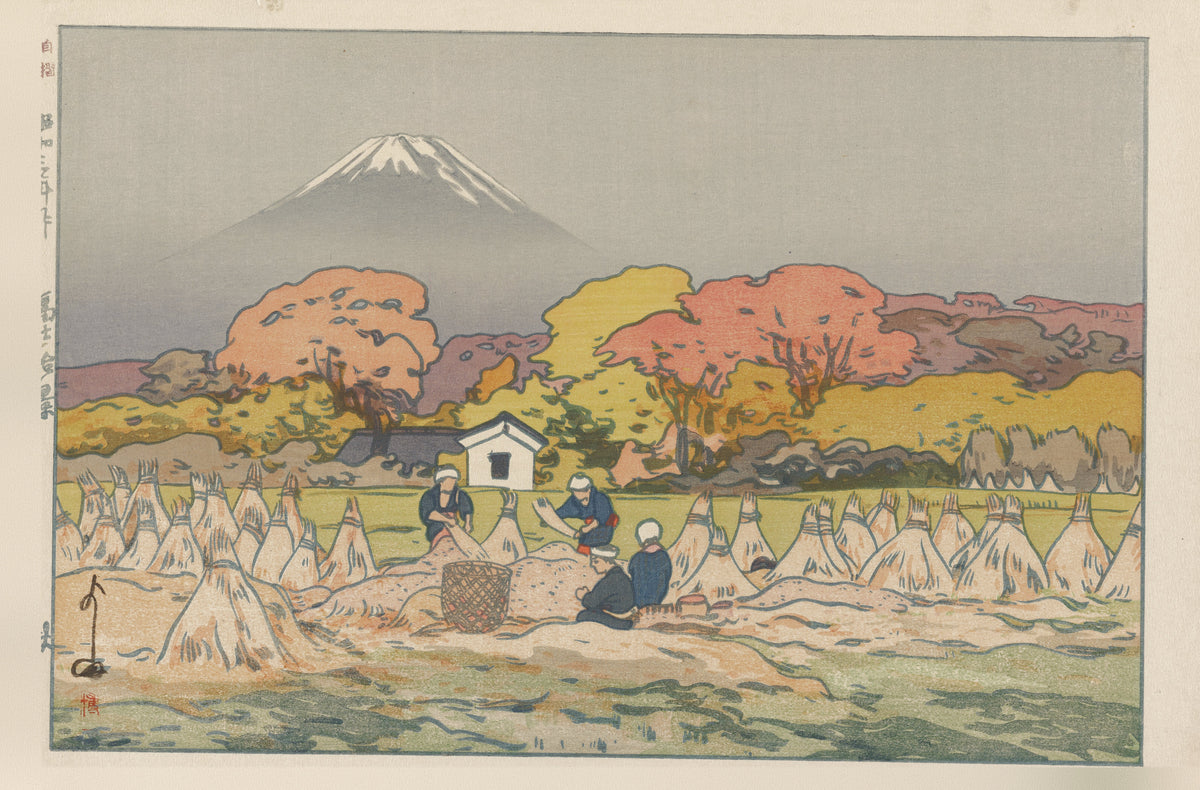 Autumn by Hiroshi Yoshida — Fuji over autumn trees and a harvest field of conical stacks